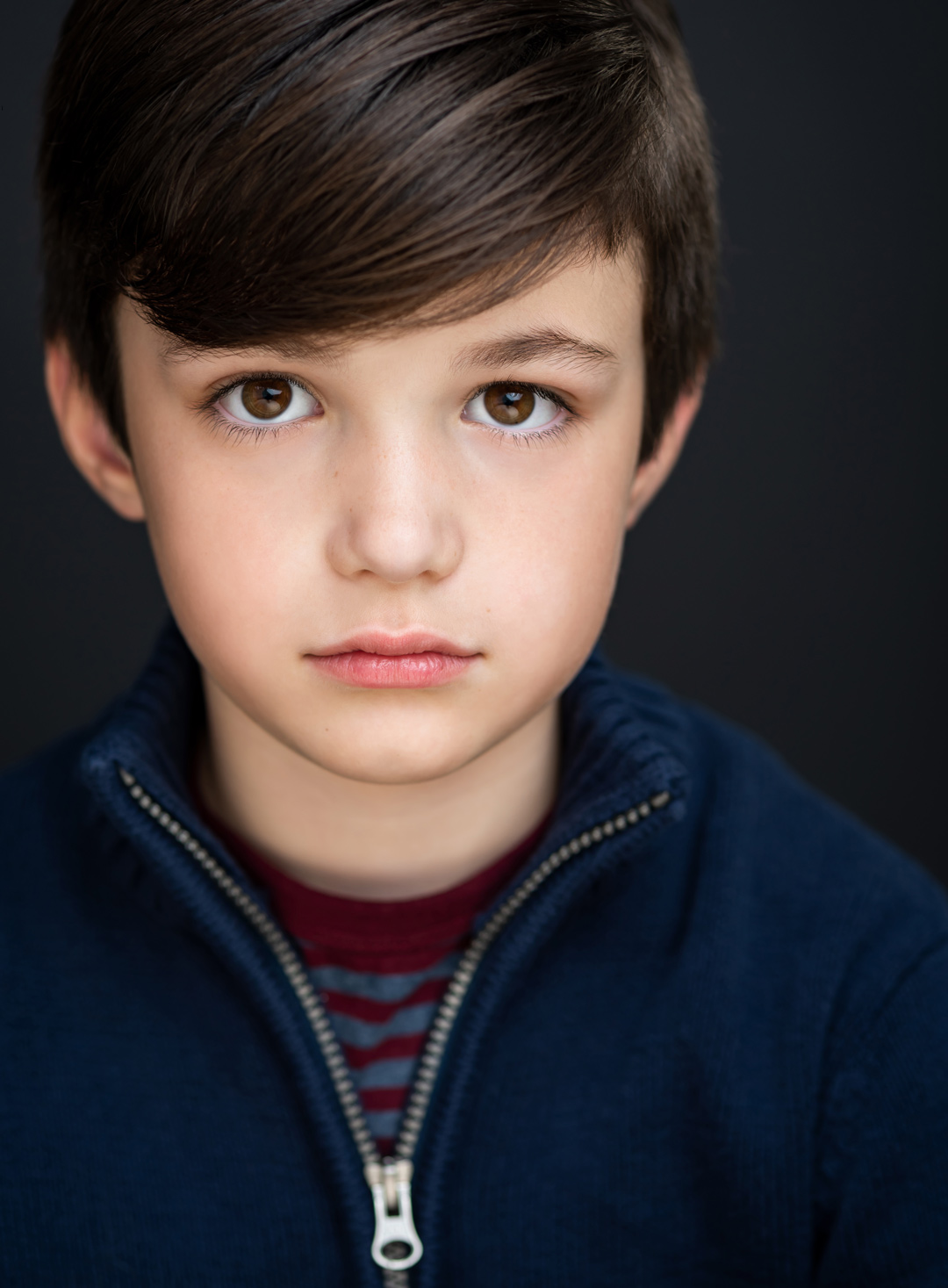 Dramatic headshot of boy child actor Matteo Bolognese