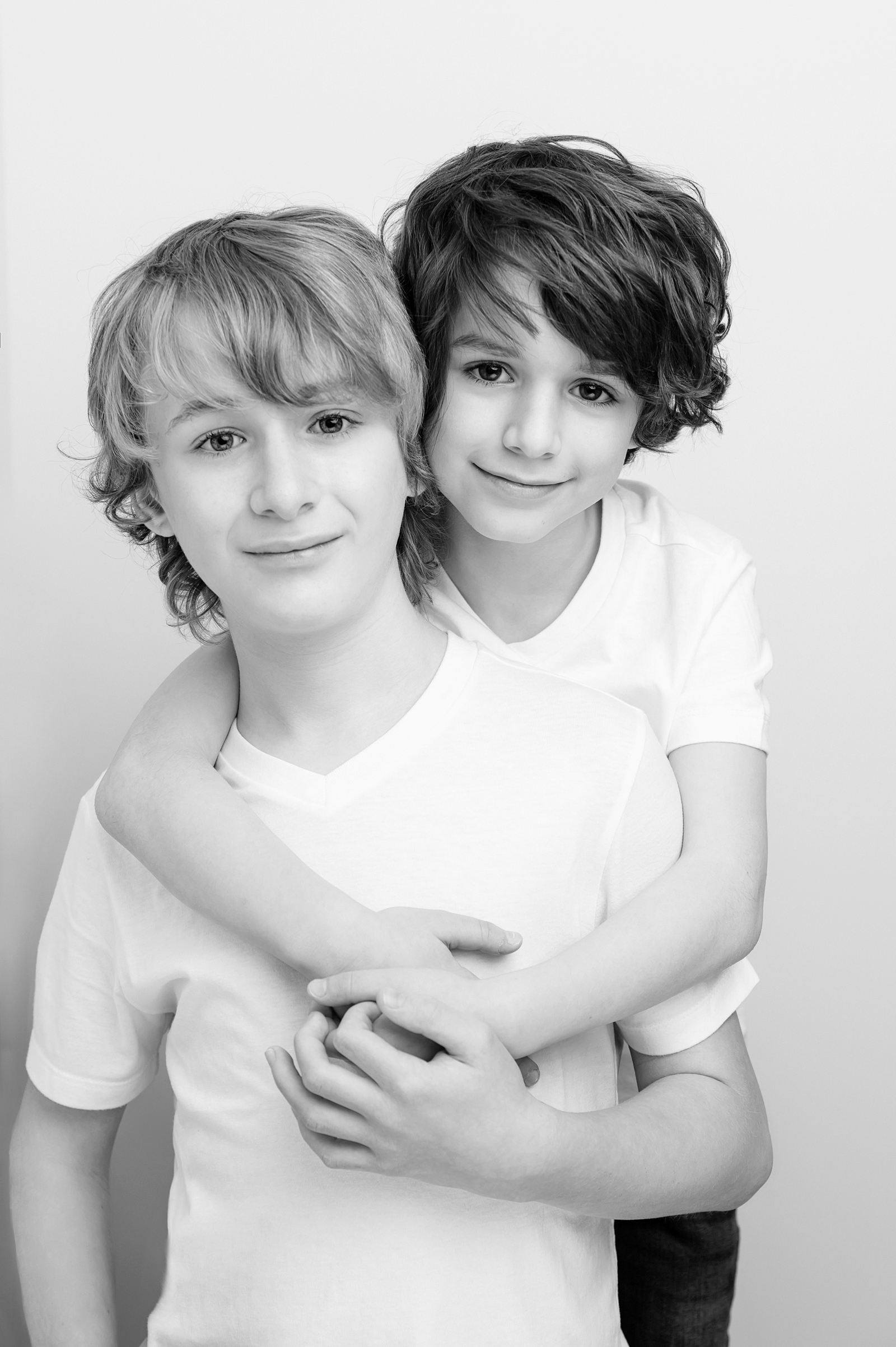 Azriel Dalman and his brother, boys in black and white vogue style photo, jeans and white tshirts